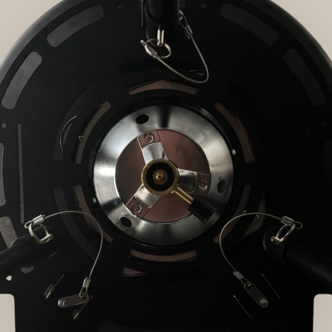Close-up of a mechanical component with a metallic finish on a dark background